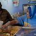 Hawa Hassan and her father serve a customer at Samosa House on Tuesday. The family restaurant has been open since November 2011 and specializes in authentic Somali cuisine. Daniel Brenner I AnnArbor.com